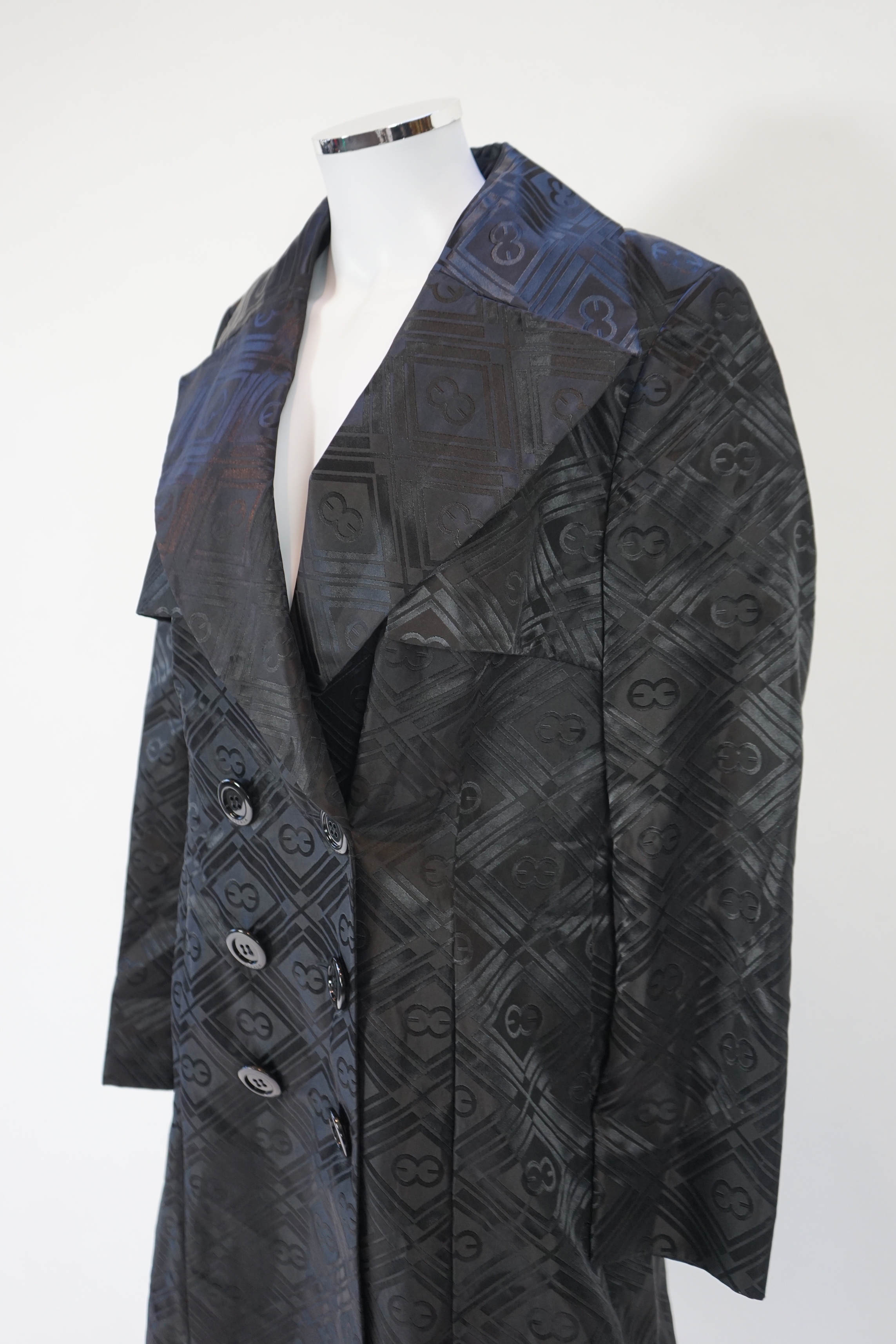 A Escada lady's monogram black trench coat, size 38